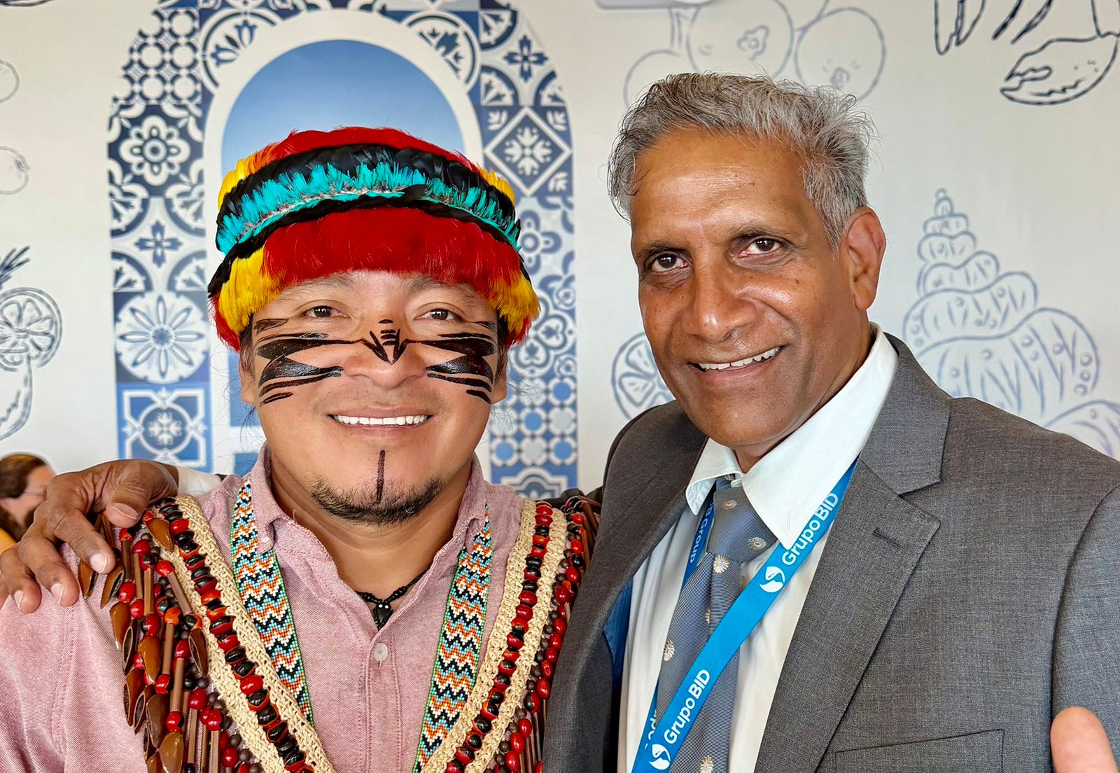 Fazal Ali beside an indigenous colleague in traditional dress
